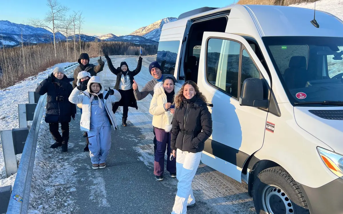 A guided group in ice cleats on the bare summer ice of the Matanuska Glacier