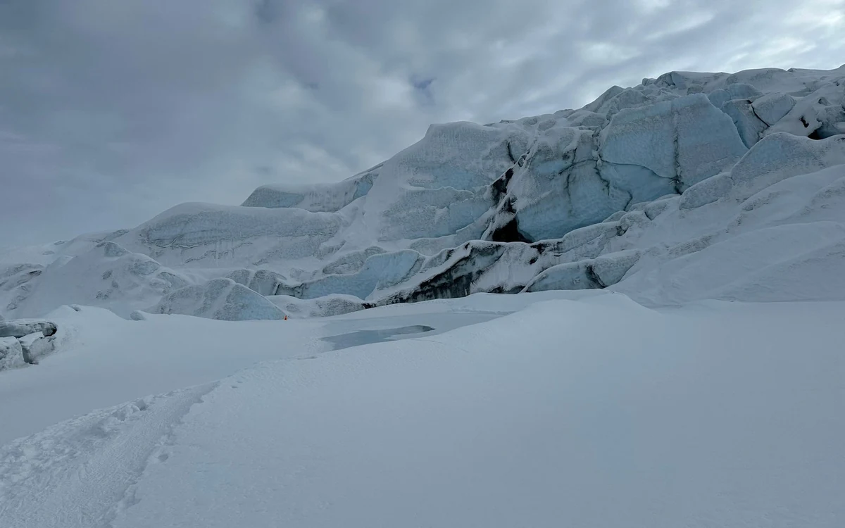 Low winter light across the ice formations of the Matanuska Glacier during a guided hike