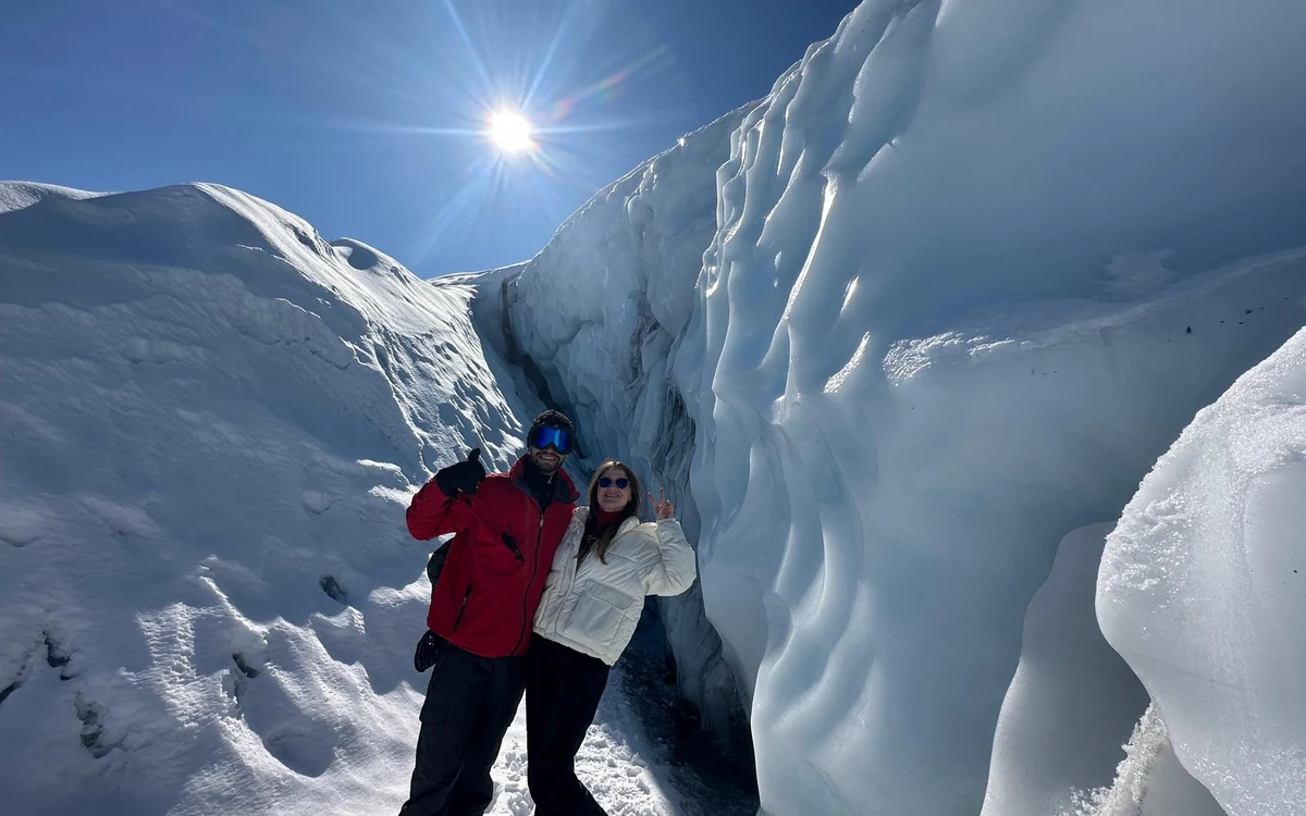 Ice cleats strapped over a walking boot on the surface of the Matanuska Glacier